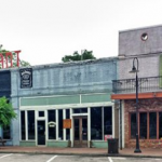 Image of colorful storefronts on rural Mississippi town square